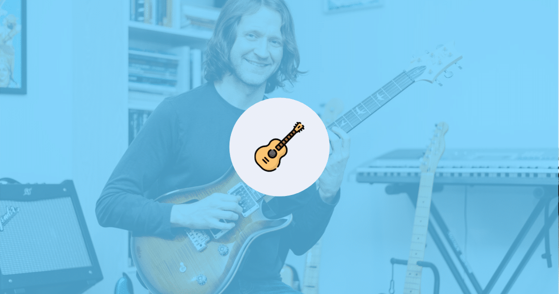A man is playing an acoustic guitar with reduced anxiety.