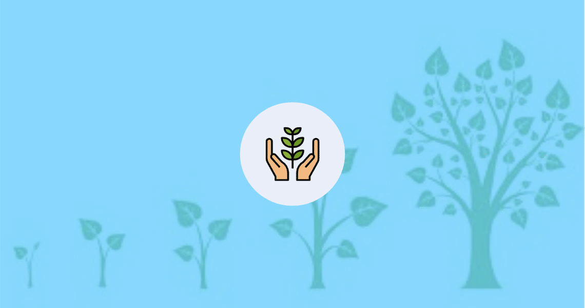 A calming hand gently cradles a tree against a serene blue background, offering tranquility and reducing anxiety.