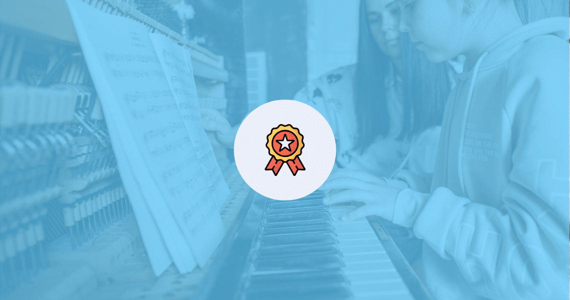 A girl practices piano with a ribbon.