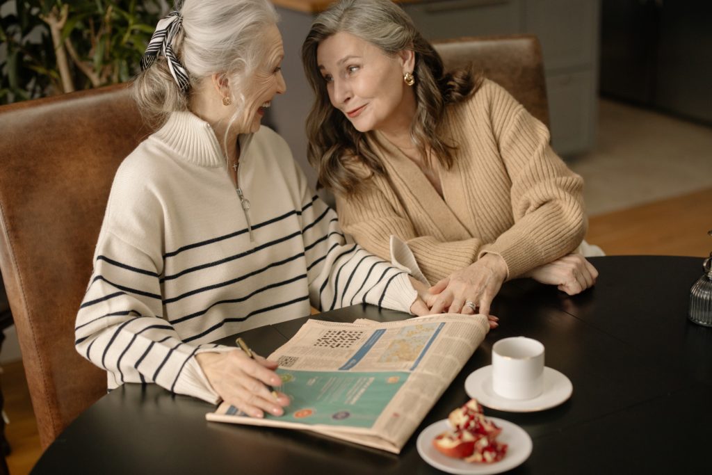 women talking about piano while doing a crossword puzzle